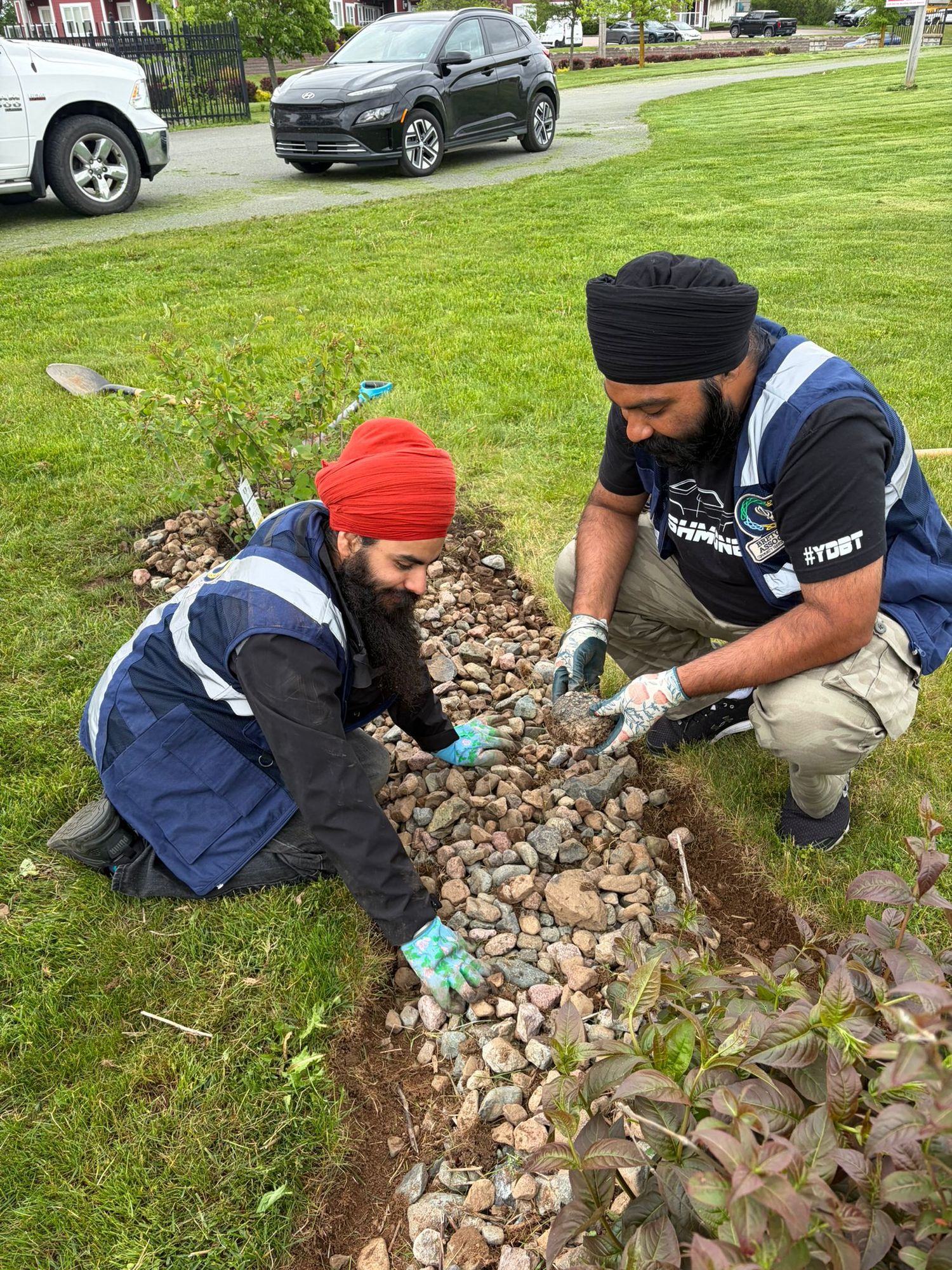 BSA volunteers landscaping a community garden bed